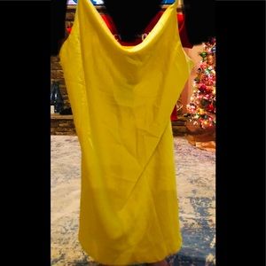 Large women’s yellow silky dress from fashion nova can be used as a long shirt